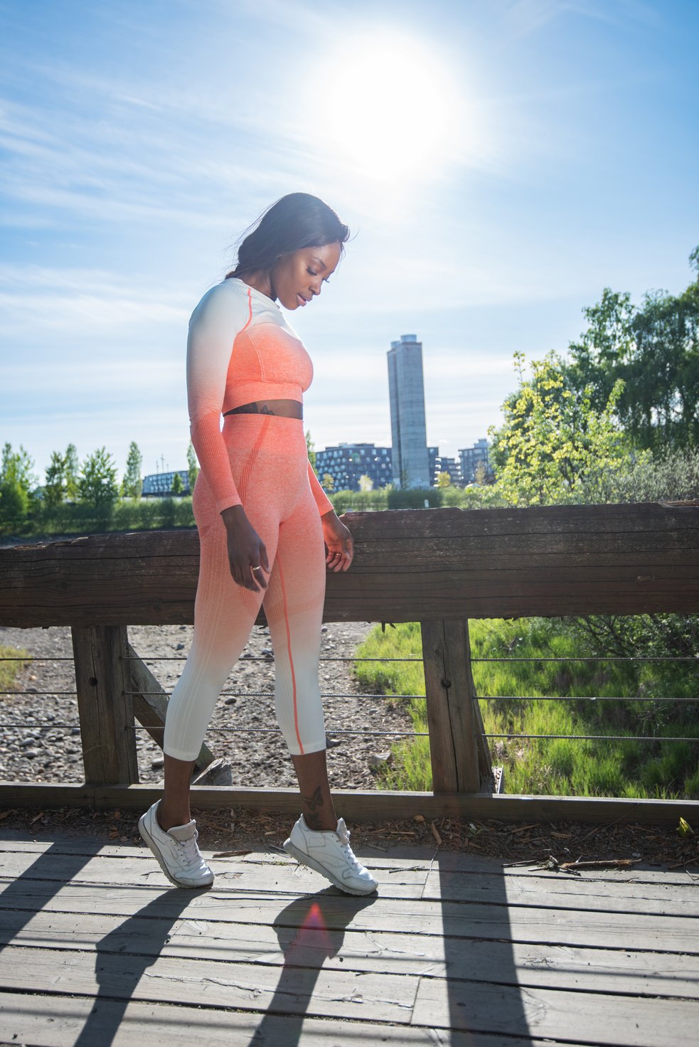 African American female walking on tiptoes.